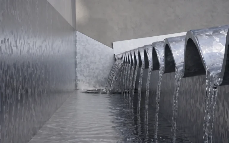 Canaleta contra muro recibiendo el agua de un techo de chapa junto a la pared